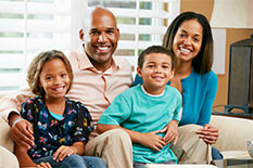 Picture of a family sitting on a couch